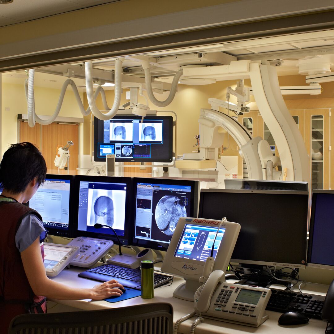 A clinician examines diagnostic readings