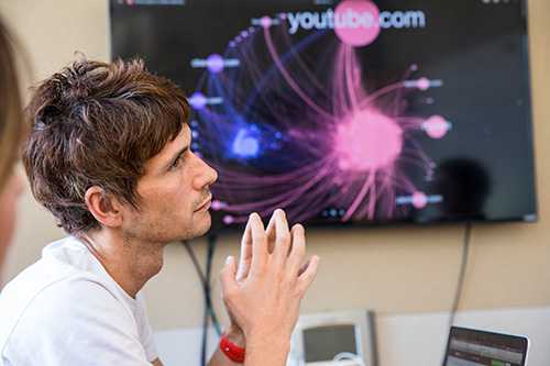 A researcher looks at a colleague